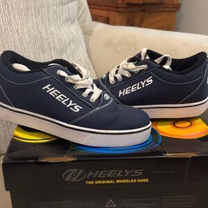 Heelys Dark Blue Skate Shoes with White Accents. Great condition gently used.